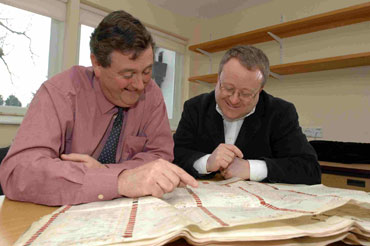 Andrew Kelly, director of Brunel 200, is shown the signature.